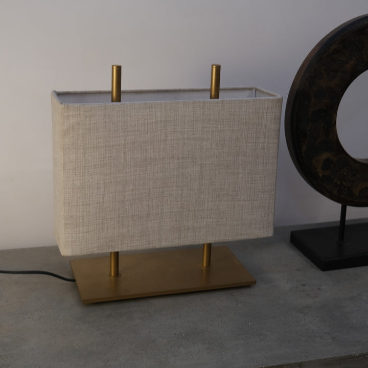 Embrace modern minimalism with our fabric and metal table lamp