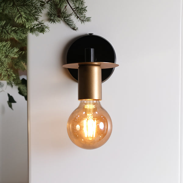 The clear, round bulb exudes warmth and sophistication, illuminating your space with a soft, ambient glow.